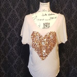 The Clas-sic tee with sequined heart.